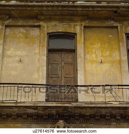 Stock Photograph - Low angle view of a door in a balcony. Fotosearch