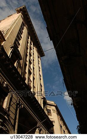 Low angle view of a skyscraper in an urban city View Large Photo Image Stock Photo - Low angle view of a skyscraper in an urban city. Fotosearch