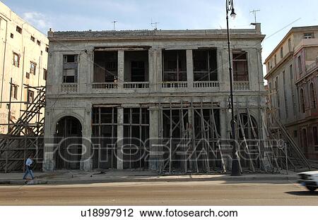View of scaffolding on the facade of a commercial building, Havana, Cuba View Large Photo Image Stock Image - View of scaffolding on the facade of a commercial building, Havana, Cuba. Fotosearch