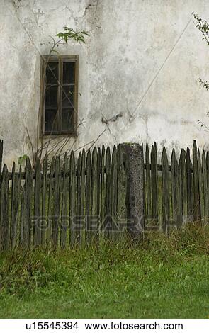 Picture - Wooden fence around a country home in Slovenia. Fotosearch