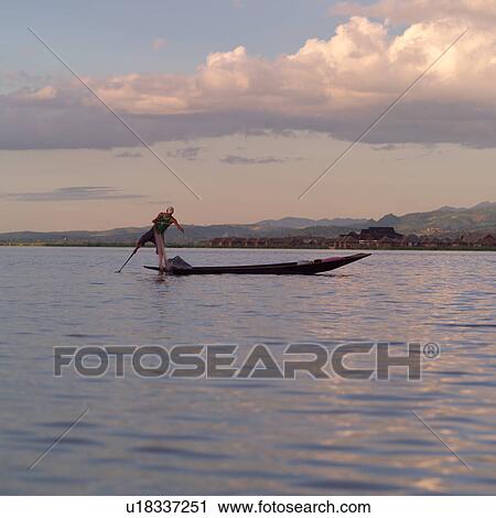 Intha fisherman in his flat-bottomed boat View Large Photo Image Stock Image - Intha fisherman in his flat-bottomed boat. Fotosearch