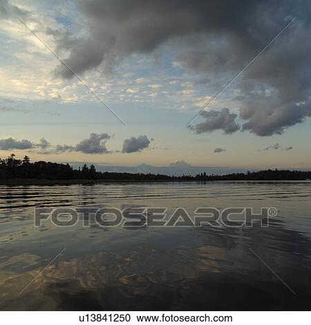 Stock Image - Overcast sky over Lake of the woods, Ontario, Canada. Fotosearch