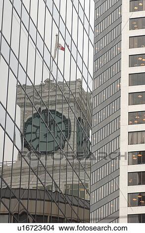 Picture - Clock Reflected in Building. Fotosearch