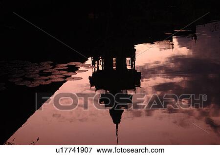 Stock Photo - Reflection of a Buddhist Temple. Fotosearch