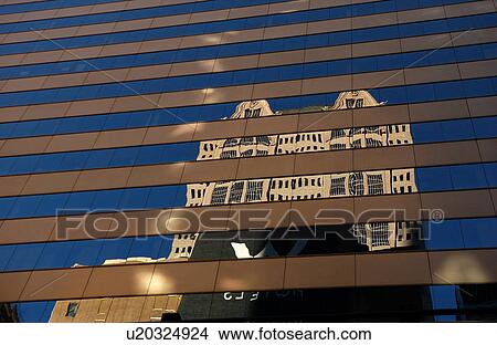 Picture - Reflection on the glass of a high rise building. Fotosearch