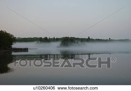Stock Photograph - Lake of the Woods at sunrise. Fotosearch