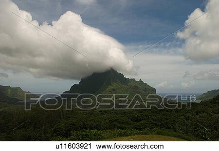 Clouds seeming to touch the top of hills near the ocean, Moorea, Tahiti, French Polynesia, South Pacific View Large Photo Image Stock Image - Clouds seeming to touch the top of hills near the ocean, Moorea, Tahiti, French Polynesia, South Pacific. Fotosearch