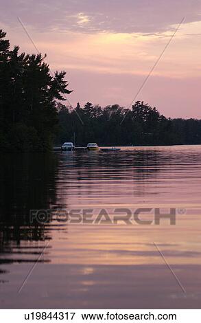 Stock Photo - Lake Photography - Sunset with lake shoreline. Fotosearch
