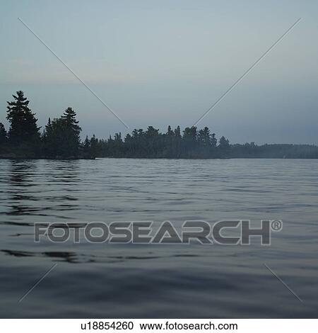 Stock Image - Lake of the Woods at Twilight. Fotosearch