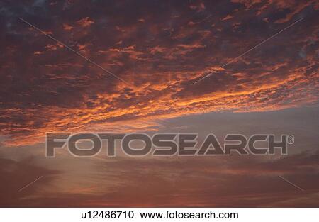 Stock Image - Lake Photography - Clouds at Sunset. Fotosearch