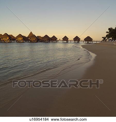 Picture - Bungalows over Water and Beach at Moorea in Tahiti. Fotosearch