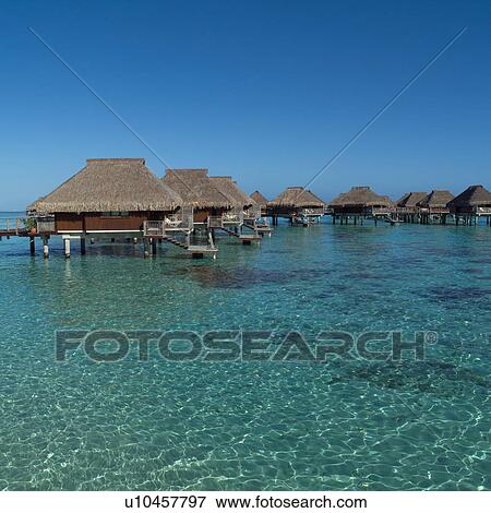 Cloudless Sky with Huts over Ocean at Moorea in Tahiti View Large Photo Image Stock Photo - Cloudless Sky with Huts over Ocean at Moorea in Tahiti. Fotosearch
