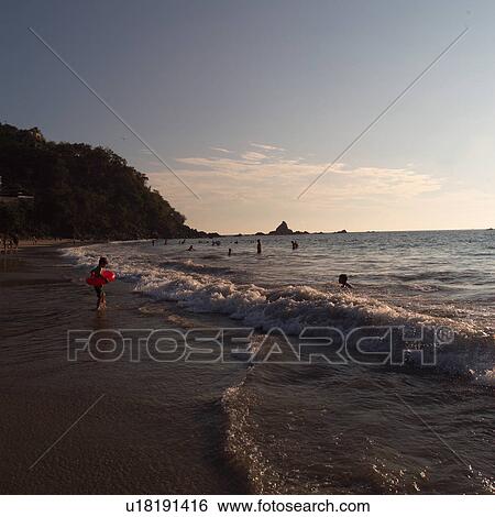 People in the ocean at Ixtapa Mexico View Large Photo Image Stock Photograph - People in the ocean at Ixtapa Mexico. Fotosearch