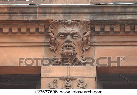 Carve human face on a stone wall of a building View Large Photo Image Stock Photograph - Carve human face on a stone wall of a building. Fotosearch
