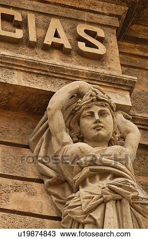 Low angle view of a female statue on a building, Havana, Cuba View Large Photo Image Stock Image - Low angle view of a female statue on a building, Havana, Cuba. Fotosearch