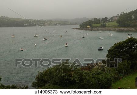 Stock Image - Rural Ireland - boats on water. Fotosearch