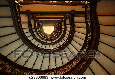 Low angle view of a spiral staircase View Large Photo Image Stock Image - Low angle view of a spiral staircase. Fotosearch
