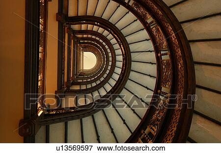 Low angle view of a spiral staircase View Large Photo Image Stock Photo - Low angle view of a spiral staircase. Fotosearch