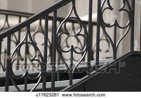 Stock Image - Metal hand rail of a staircase in Montreal, Canada. Fotosearch