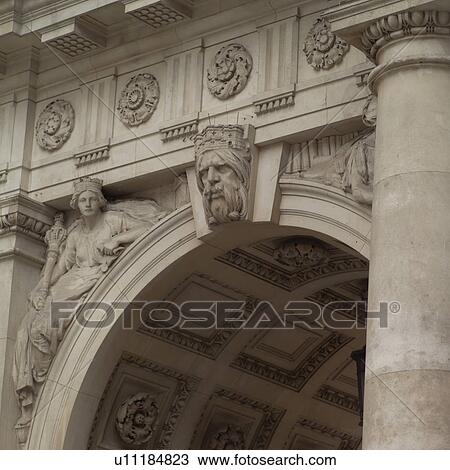 Stone carvings on an archway of a building View Large Photo Image Stock Image - Stone carvings on an archway of a building. Fotosearch