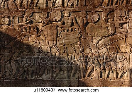 Carving on wall of Khmer Kingdom palace ruins View Large Photo Image Stock Photo - Carving on wall of Khmer Kingdom palace ruins. Fotosearch