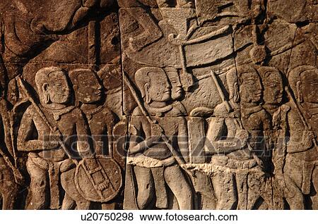 Carving on wall of Khmer Kingdom palace ruins View Large Photo Image Stock Photo - Carving on wall of Khmer Kingdom palace ruins. Fotosearch