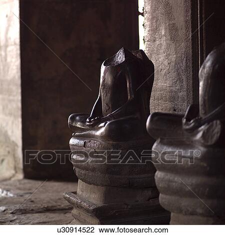 Damaged Statue inside Khmer Kingdom palace ruins View Large Photo Image Stock Image - Damaged Statue inside Khmer Kingdom palace ruins. Fotosearch