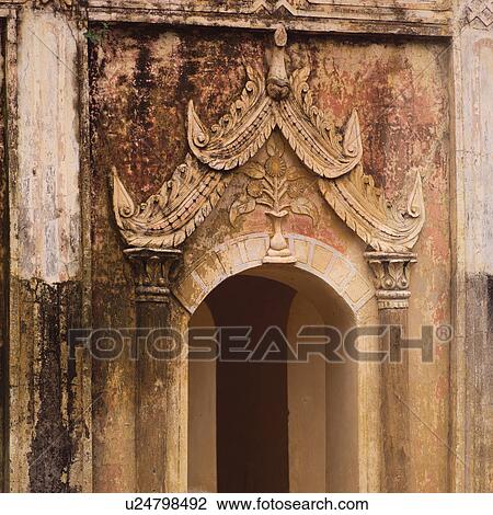 Stock Image - Exterior wall of Buddhist Temple. Fotosearch