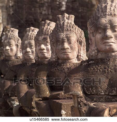 Stock Photography - Large Buddha statues at the Khmer Kingdom palace ruins. Fotosearch