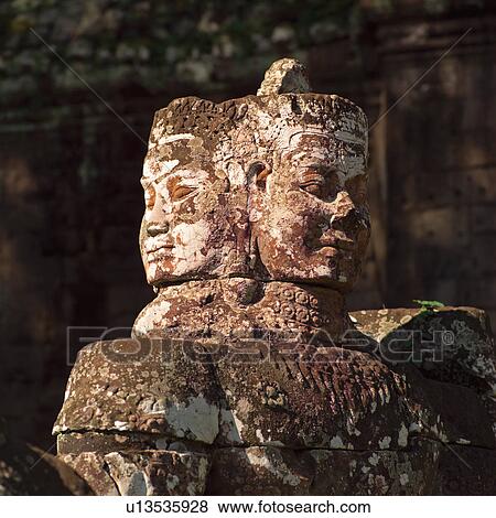 Statue at the Khmer Kingdom palace ruins View Large Photo Image Stock Photo - Statue at the Khmer Kingdom palace ruins. Fotosearch