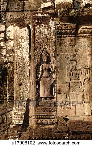 Statue on wall of Khmer Kingdom palace ruins View Large Photo Image Stock Image - Statue on wall of Khmer Kingdom palace ruins. Fotosearch