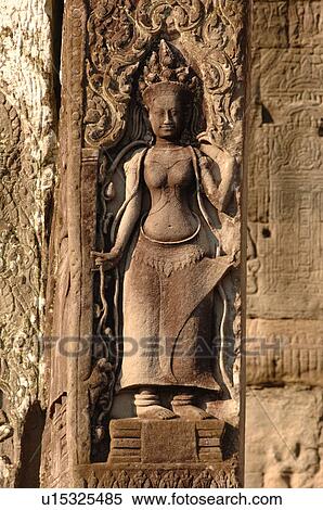 Statue on wall of Khmer Kingdom palace ruins View Large Photo Image Stock Photography - Statue on wall of Khmer Kingdom palace ruins. Fotosearch