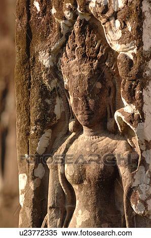 Stock Photography - Statue on wall of Khmer Kingdom palace ruins. Fotosearch