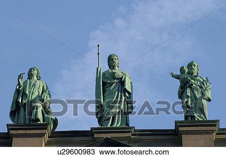 Stock Image - Low angle view of the tope of a building with statues in Montreal, Canada. Fotosearch