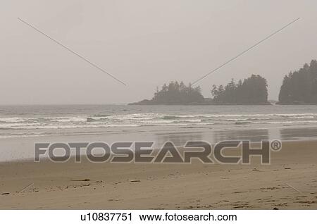 Stock Image - Beach on a cloudy day, Florencia Bay, Vancouver Island, Canada. Fotosearch