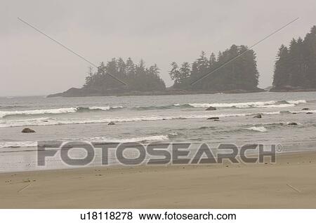 Stock Photo - Beach on a cloudy day, Florencia Bay, Vancouver Island, Canada. Fotosearch