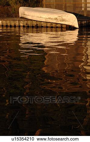 Canoe upside down on dock View Large Photo Image Stock Image - Canoe upside down on dock. Fotosearch