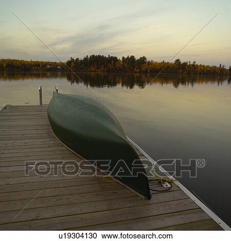 Canoe Upsidedown on Dock View Large Photo Image Stock Image - Canoe Upsidedown on Dock. Fotosearch