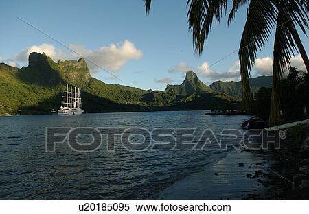 View of the sea and hills beyond it from a beach, Moorea, Tahiti, French Polynesia, South Pacific View Large Photo Image Stock Photography - View of the sea and hills beyond it from a beach, Moorea, Tahiti, French Polynesia, South Pacific. Fotosearch