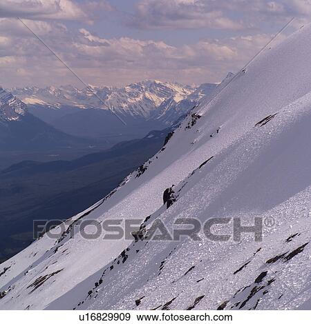 Stock Photo - Snowy slopes of Rocky Mountains. Fotosearch