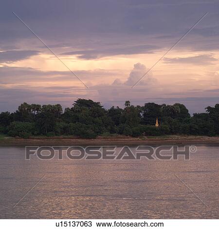 Stock Image - Shoreline along Ayeyanwady River. Fotosearch