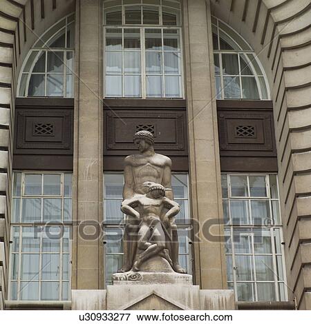 Statue in front of a building in London, England View Large Photo Image Stock Photo - Statue in front of a building in London, England. Fotosearch