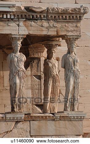 Stock Image - Statues on an ancient historical building in Athens, Greece. Fotosearch
