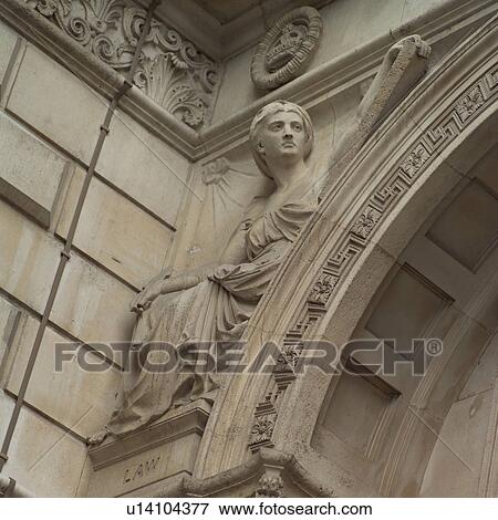 Stone carvings on an archway of a building in London, England View Large Photo Image Stock Photo - Stone carvings on an archway of a building in London, England. Fotosearch