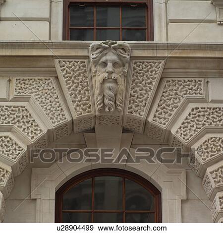 Stone carvings on an archway of a building in London, England View Large Photo Image Stock Photo - Stone carvings on an archway of a building in London, England. Fotosearch