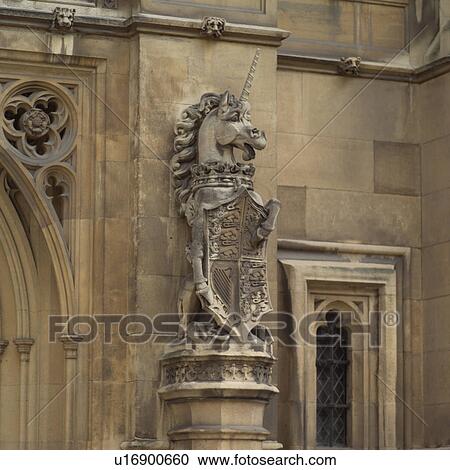 Stock Image - Stone statue in an ancient historical building in London, England. Fotosearch