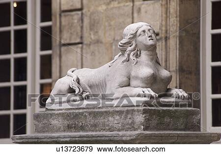 Stone statue outside a building in Paris, France View Large Photo Image Stock Photo - Stone statue outside a building in Paris, France. Fotosearch