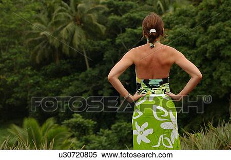 Rear of a young woman wearing a halter dress View Large Photo Image Stock Photography - Rear of a young woman wearing a halter dress. Fotosearch