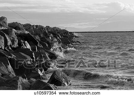 Picture - Water crashing into rocks. Fotosearch