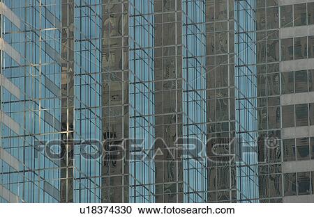 Stock Image - Glass front of a high-rise building. Fotosearch